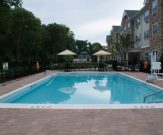 Apartment pool, commercial pool geometric with deck pavers